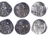 an image of a group of silver coins on a white surface