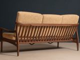 an image of a wooden couch with a tan upholstered cushion
