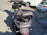 a scooter that is parked in a parking lot