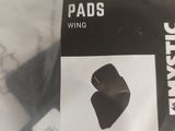 a picture of a pair of knee pads in a plastic bag