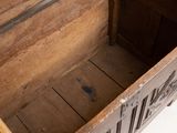 a wooden chest with a lid open on a white surface