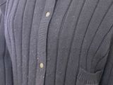 an image of a woman ' s sweater with buttons on it