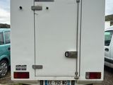 an image of a white truck parked in a parking lot