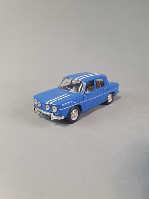 a blue toy car that is sitting on a table