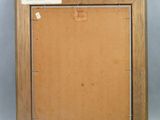 an old picture frame with a piece of wood in it