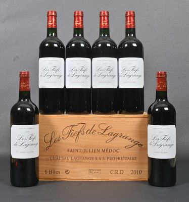 six bottles of red wine in a wooden crate with a grey background