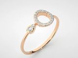 a rose gold ring with diamonds on a white background