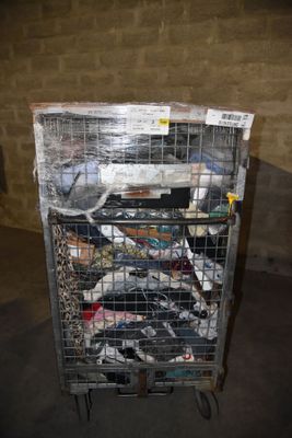 a metal cart with a bunch of items in it