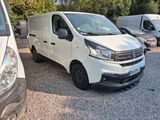 a white van that is parked in a parking lot