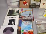 several books on a table that are sitting on top of each other