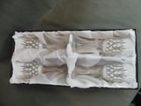 four forks and spoons in a box on a table