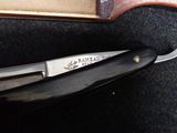 a knife that is laying on top of a book