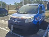 a small blue van parked in a parking lot next to a car