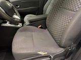 a close up of a car ' s front seat with a control button