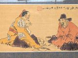 two men sitting on the ground playing a game of chess