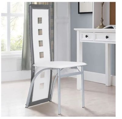 the chair is white and has a metal frame around the seat