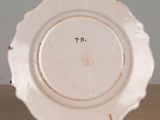 a white plate that has a black writing on it