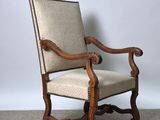 an old wooden chair with beige upholstered upholstered upholstered upholstered upholstered