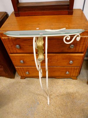 a glass table with a knife on top of it