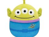 disney pixal plush toy sitting on a white surface
