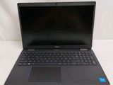 the laptop is open on a white surface with a black keyboard