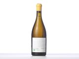 a bottle of white wine sitting on top of a table