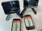 four garmin garmins are sitting next to each other on a table
