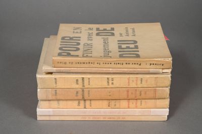 several books stacked on top of each other on a table