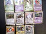 a lot of pokemon cards on the table