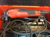 an orange tool box filled with tools like a drill, screwdriver, and other tools