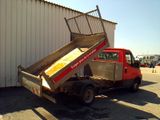 a red truck that is parked in front of a building