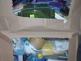 a cardboard box that has a bunch of items inside of it