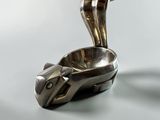 a silver plate with a spoon and a spoon in it