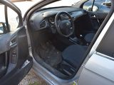 a car with the door open and the driver ' s seat down