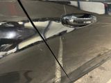 a close up of a car ' s door handle and door handle