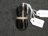 a ring that is sitting on top of a black object