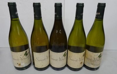 six bottles of wine are lined up on a table