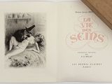 un livre sur la couverture duquel figure la photo d'une femme nue