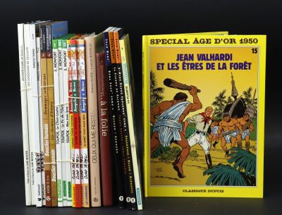 several books are stacked on top of each other on a black surface