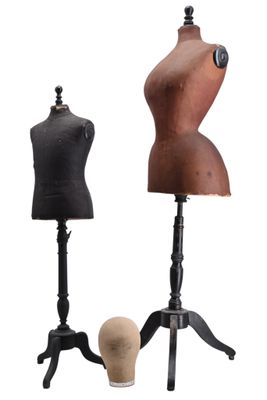 three mannequins and a tripod stand on a white background