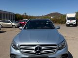 mercedes c - class in silver parked in a parking lot