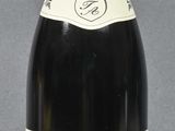 a bottle of wine that is sitting on a table