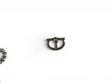 pair of antique iron horseshoes and chain on a white background