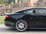 a black sports car parked on the side of the road
