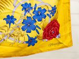 a yellow flag with blue flowers and a red rose on it