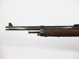 a close up of a rifle on a white surface with a white background