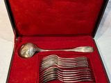 a box with a set of spoons and a spoon in it