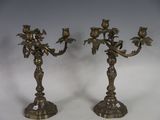 pair of antique brass candlesticks with flowers and leaves