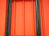 a picture of a picture frame hanging on a red wall