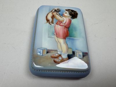 a small tin with a picture of a girl and a dog on it
